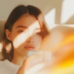 Contemplative-Woman-with-Smartphone-e1748489655232